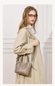 Detail view of the elegant leather bucket bag, showing premium texture and shoulder strap.