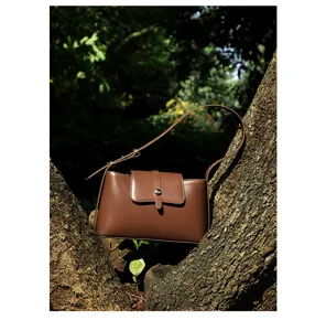 Echt lederen dames bruine schoudertas, niche design chique minimalistische handtas voor dagelijks.