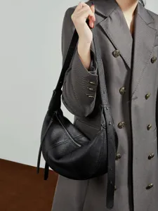 Black genuine leather croissant shoulder bag, stylish crescent crossbody purse for women.