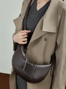 Genuine leather crescent shoulder bag for women, stylish minimalist dumpling crossbody bag for daily commute.