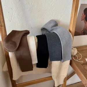 Knit long socks detail view, featuring ribbed texture and multiple versatile neutral colors.