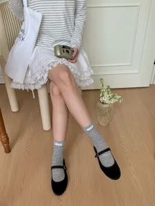 Japanese style combed cotton mid-tube grey socks with cute fabric label detail for women.