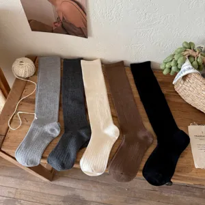 Detailed view of women's wool silk long socks in multiple classic solid colors for autumn and winter warmth.
