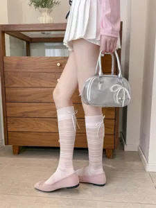 Sheer striped knee-high socks featuring a sweet ballet bow design, lightweight for spring and summer.