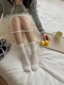 Japanese style cotton hollow stacked socks detail view, featuring cute mini woven label.