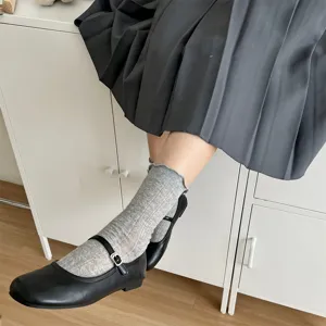 Detailed shot of women's grey ruffled mesh mid-tube socks, perfect for summer daily wear.