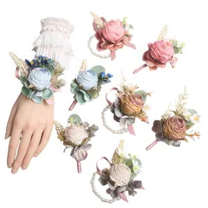 European style artificial rose wedding boutonnieres and wrist flower sets for groom and bridal.