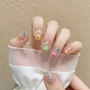 Cute summer dessert press-on nails with 3D candy and cake charms, elegant style main view.