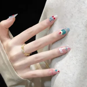 Sweet cherry pudding press-on nails with lace bow design for summer fashion wear.