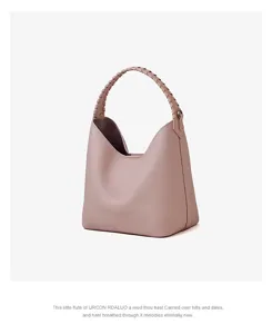 Borsa a secchiello in vera pelle rosa per donna, elegante borsa hobo con manico intrecciato.