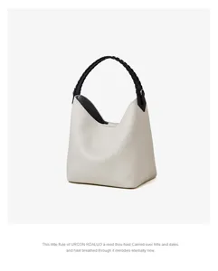 Chic borsa a secchiello in pelle con manico intrecciato nero, elegante borsa casual.