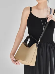 Borsa a secchiello in vera pelle alla moda con manico intrecciato, borsa a tracolla versatile.