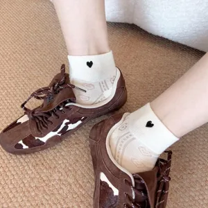 Breathable white cotton socks featuring black heart embroidery and hollow design for summer wear.
