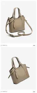 Taupe leather tote bag detail showcasing smooth texture, double handles and strap hardware.