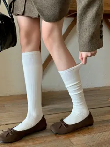 White ribbed knit knee high socks for women, soft wool blend warm winter tube stockings.