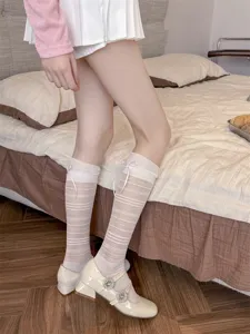 Sheer striped knee high socks featuring cute bow details, perfect for daily outfits.