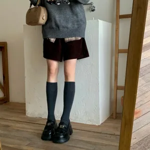 Knee high dark gray wool socks worn with loafers and shorts in daily outfit main product view.