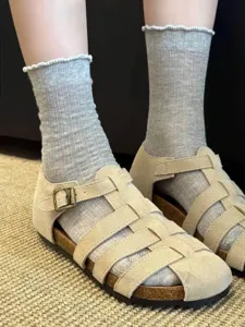 Grey ribbed ruffle-trim socks detail shot, showcasing soft cotton knit and vintage style.