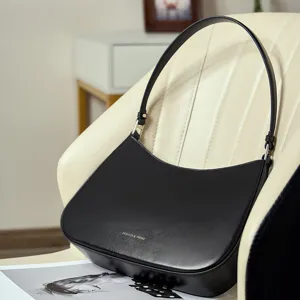 Classic black leather underarm shoulder bag for women, stylish minimalist hobo handbag.