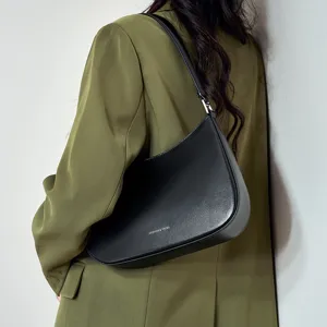 Minimalist black leather shoulder bag for women, chic underarm hobo bag for daily fashion.