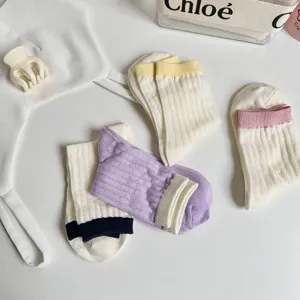 Stylish women ribbed mid-calf socks with lovely contrast color cuffs for daily wear.