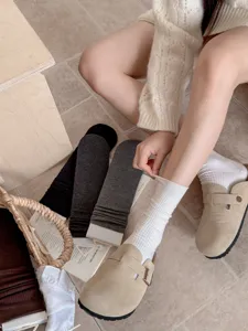Women's solid color ribbed mid-tube socks, soft daily knit hosiery for autumn season.