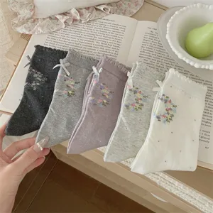 Korean style sweet floral bow mid-calf socks detailed view, elegant lace trim mesh design.