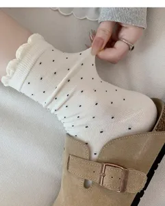 White polka dot mid-calf socks for women, cute ruffled lace design, soft cotton slouchy socks.