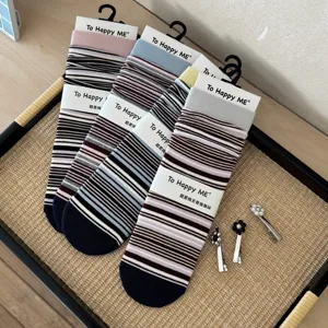 Retro striped stack socks for women, soft cotton casual mid-tube socks with cute hair clips.