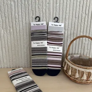 Striped slouch socks detailed view showing retro color matching and soft texture.