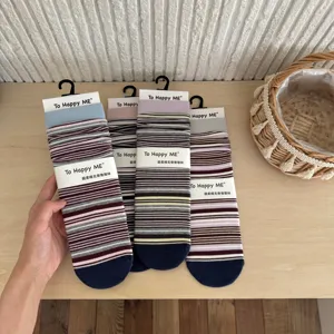 Vintage striped mid-tube slouch socks, Japanese color-block design, cozy soft cotton.