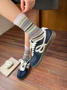 Retro striped mid-tube socks for women, stylish Japanese color-blocking casual daily wear.
