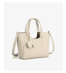 Casual large capacity tote bag with top handles, strap and elephant charm for commute.