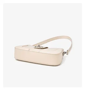 Retro chic minimalist leather shoulder bag detail, stylish cream white crossbody handbag.