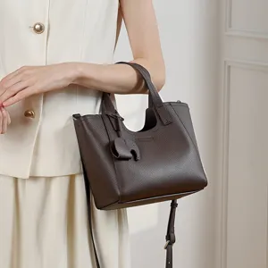 Stylish dark brown leather tote bag for women, perfect daily commuter shoulder handbag.
