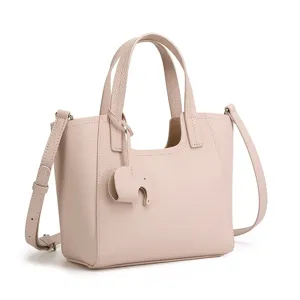 Chic minimalist pink leather tote bag for women daily commute spacious shoulder handbag.