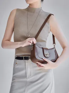 Retro brown leather shoulder bag for women, stylish hobo crossbody bag with metal buckle.