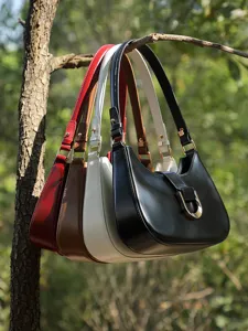 Minimalist genuine leather hobo shoulder bag for women, stylish everyday commuter baguette handbag.