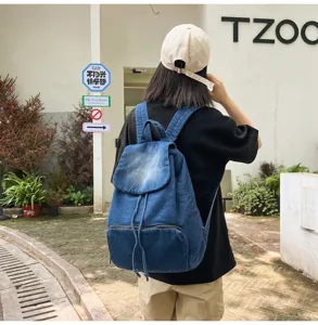 Vintage blue denim backpack for women, casual large capacity school bookbag with drawstring.