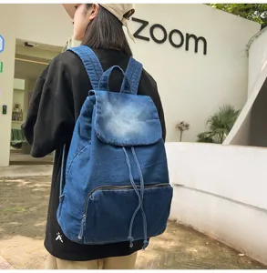 Detail view of a vintage denim backpack for women, stylish and spacious daily bag.