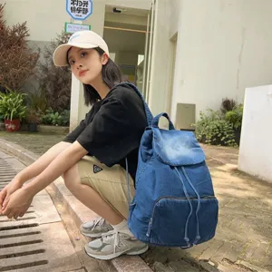 Retro versatile denim canvas backpack for women, casual solid color large capacity travel bag.