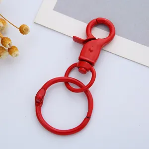 Red metal lobster clasp keychain detail shot, DIY jewelry making accessory component.