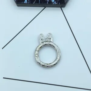Metal spring keychain ring detail, silver tone snap hook with cute bow and ears design.