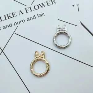 Metal spring keychain ring in gold and silver colors with cute bow design for DIY hardware.