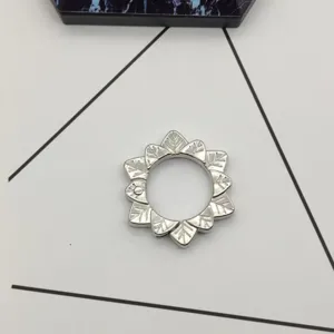 Silver metal flower shape spring ring keychain hardware accessory for bags and keys.