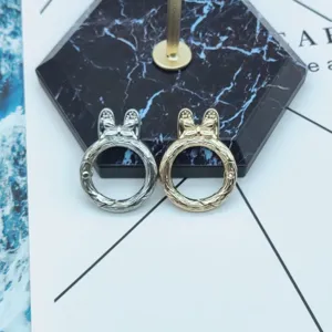 Metal spring keychain rings detail shot, featuring silver and gold alloy bunny ear bow hardware.