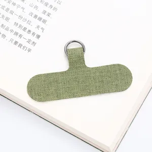 Grüner Handy-Gurt-Anschluss aus Stoff mit Metallring, sicherer Patch für Smartphone Umhängeband.