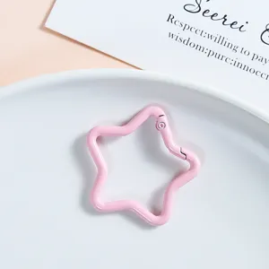 Pink star spring buckle detail, metal snap hook clip for DIY crafts and jewelry making.