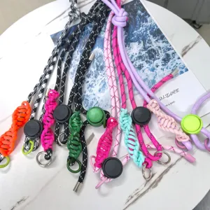 Crossbody phone lanyard detail showing colorful braided adjustable straps with metal rings.