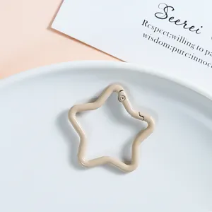 Star-shaped metal spring buckle, khaki color, detailed view of DIY jewelry accessory hardware.